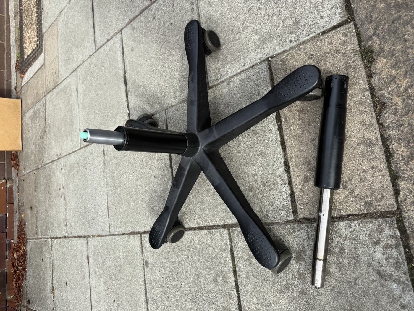 Office chair five-star base with a new gas lift fitted, old cylinder alongside
